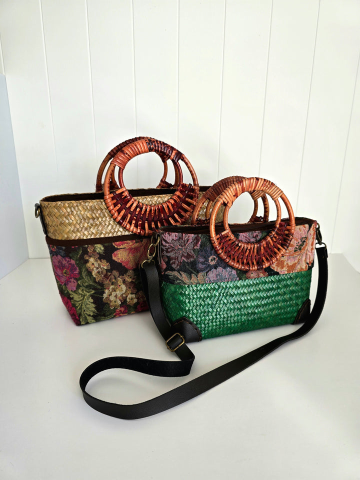 Two woven handbags with floral patterns on a white surface