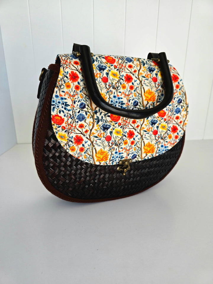 Handbag with floral pattern on a white background