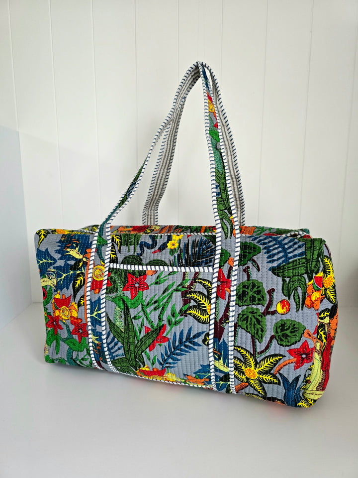 Colorful floral-patterned bag with a white background