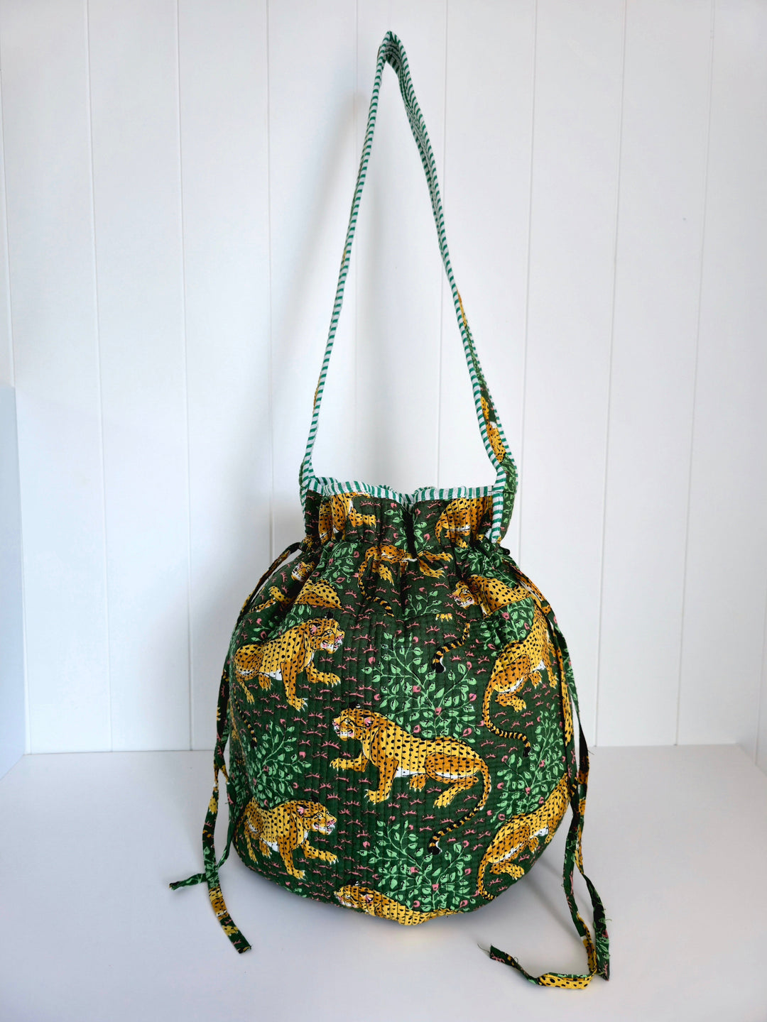 Drawstring bag with leopard print on a white background
